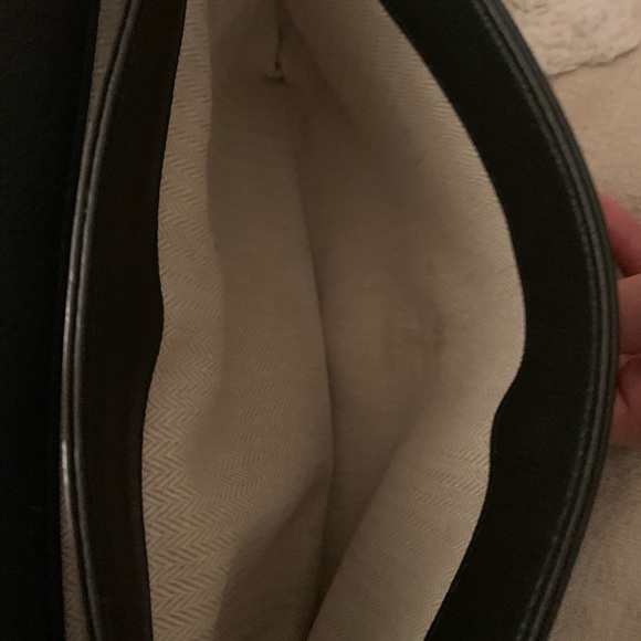 Tory Burch—100% leather. This bag has lots of room, three pockets. - Picture 9 of 10